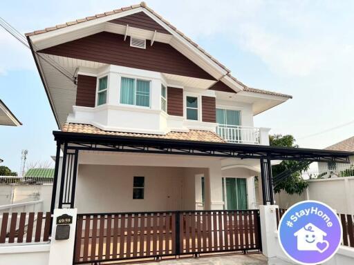 Modern two-story house with carport and balcony