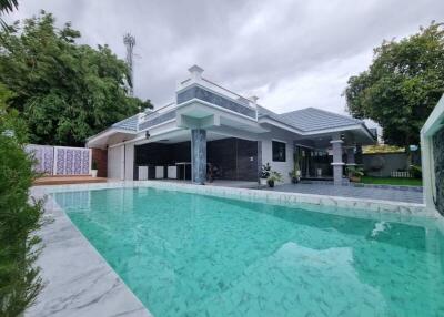 Luxurious home exterior with spacious swimming pool