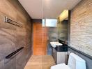 Modern bathroom with stone tiles and sleek fixtures