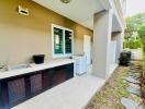 Spacious outdoor kitchen with modern amenities and ample sunlight