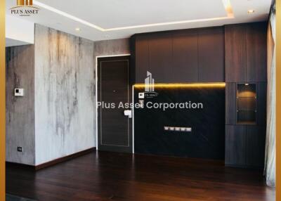 Modern living room with elegant dark wood paneling and concrete accent wall