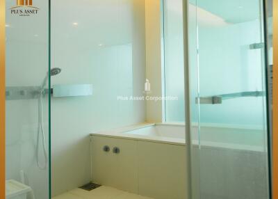 Modern bathroom with glass shower and bathtub