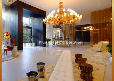 Elegant lobby interior with chandelier and luxurious furnishings