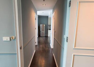 View of a residential corridor leading to a kitchen