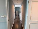 View of a residential corridor leading to a kitchen