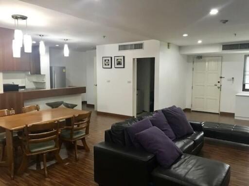 Spacious living room with integrated dining area and open kitchen