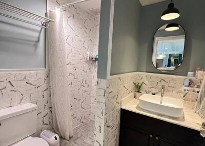 Modern bathroom with stylish fixtures and LED lighting