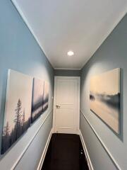 Modern hallway with decorative wall art and sleek design