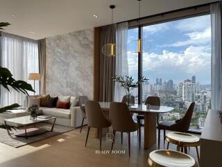 Modern living room with dining area and panoramic city view