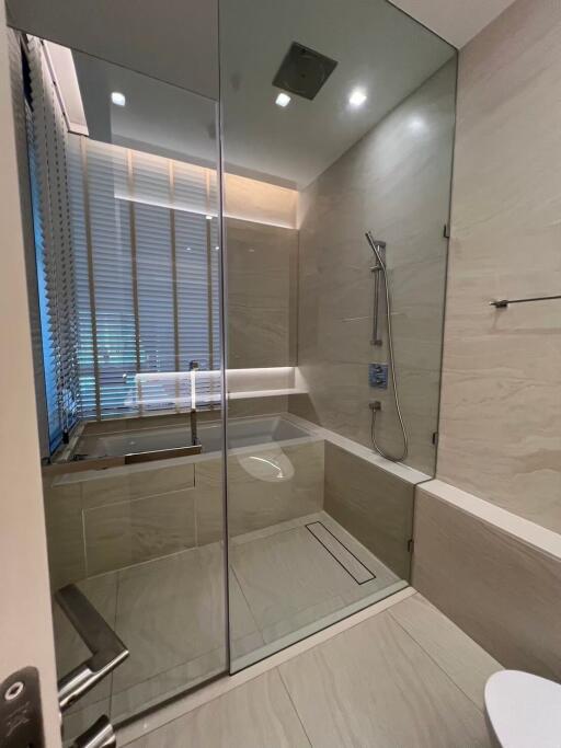 Modern bathroom with walk-in shower and neutral tones