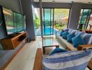 Spacious living room with view of the pool and modern furnishings