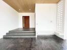 Spacious living room with wooden ceiling and tiled flooring