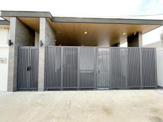 Modern home exterior with stylish metallic gate