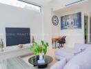 Spacious modern living room with artistic decor and abundant natural light