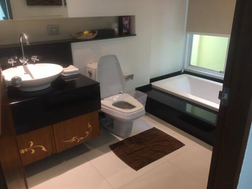 Modern bathroom with integrated laundry area