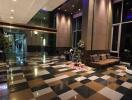 Elegant lobby area with checkerboard floor and modern furnishings