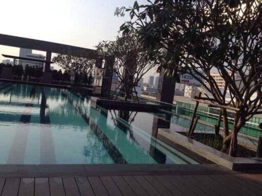 Luxurious rooftop swimming pool with city skyline view