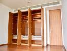Spacious bedroom with large built-in wooden wardrobe