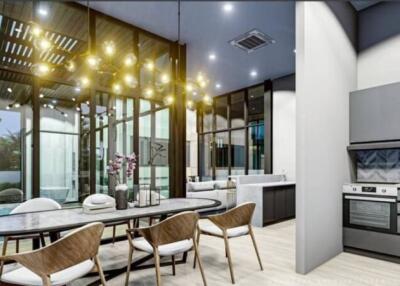 Modern kitchen and dining area with elegant lighting and appliances