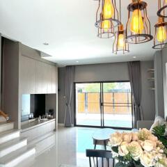 Modern spacious living room with stylish decor and natural lighting