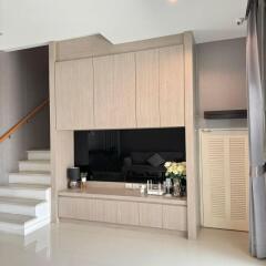 Modern living room with custom built-in cabinetry and minimalist decor