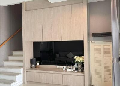 Modern living room with custom built-in cabinetry and minimalist decor