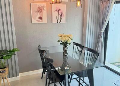 Elegant dining room with modern decor and artistic wall art