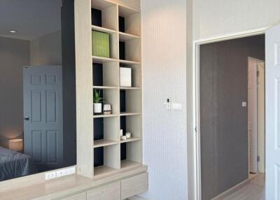 Modern bedroom with custom shelving and sleek design