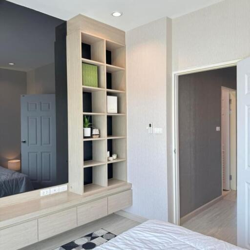 Modern bedroom with custom shelving and sleek design