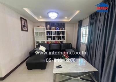 Spacious living room with modern sofa and decorative lighting