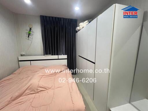 Compact and well-furnished bedroom with modern amenities