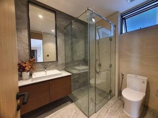 Modern bathroom with glass shower and elegant finishes