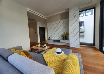 Modern living room with marble accents and comfortable seating