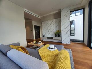 Modern living room with marble accents and comfortable seating