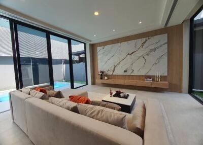 Spacious living room with large sectional sofa and modern design