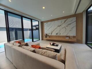 Spacious living room with large sectional sofa and modern design