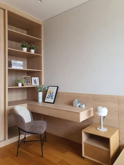 Modern minimalist living room with built-in wooden shelving