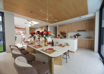 Modern open plan kitchen and dining area with elegant decor