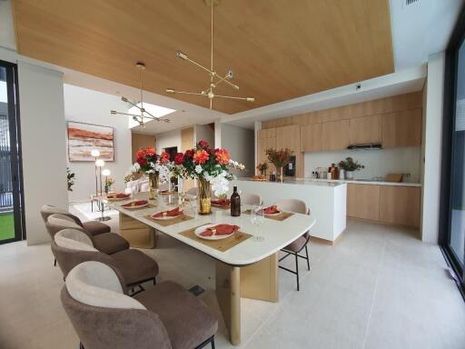 Modern open plan kitchen and dining area with elegant decor