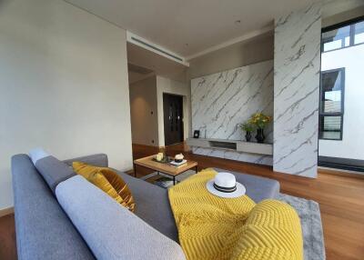 Spacious modern living room with marble wall