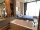 Elegant bedroom with attached open bathtub and large window