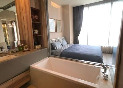 Elegant bedroom with attached open bathtub and large window