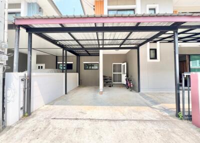 Spacious covered garage with organized storage and secure entrance