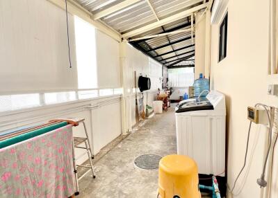 Spacious utility area with laundry facilities and storage