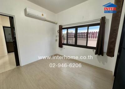Spacious bedroom with modern air conditioning and large window