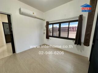 Spacious bedroom with modern air conditioning and large window