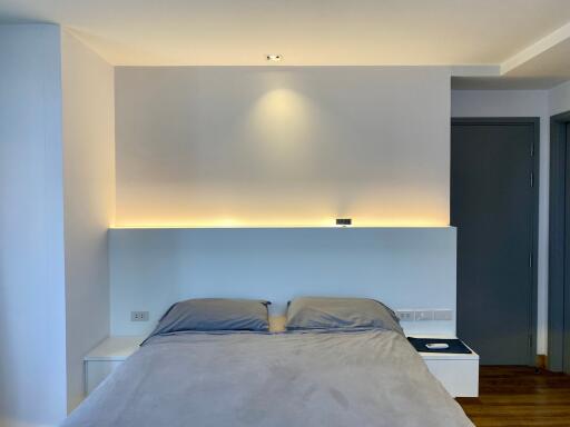 Modern bedroom with ambient lighting and minimalistic design