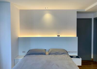 Modern bedroom with ambient lighting and minimalistic design