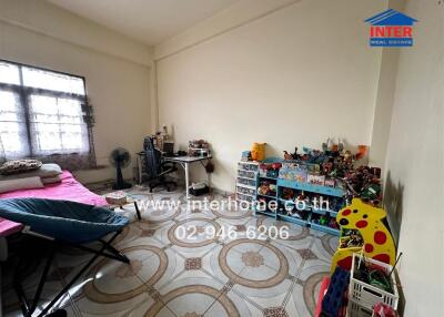 Spacious bedroom with decorative floor tiles and large window