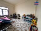 Spacious bedroom with decorative floor tiles and large window